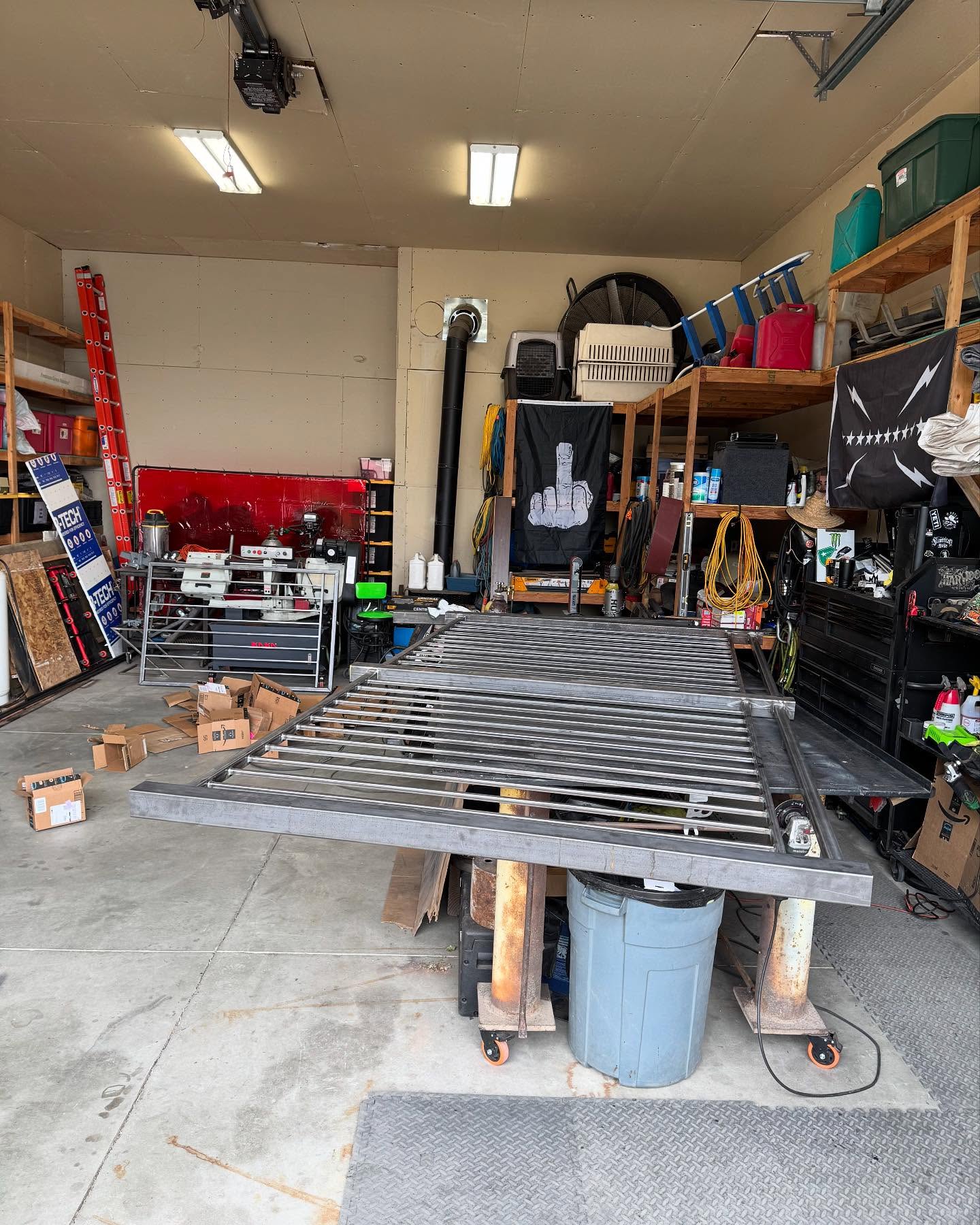 Custom horizontal-slat metal gate panel in the fabrication shop